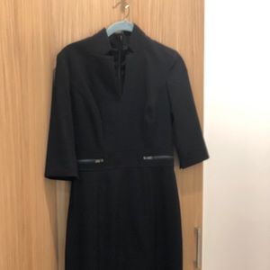 Form fitting black dress.